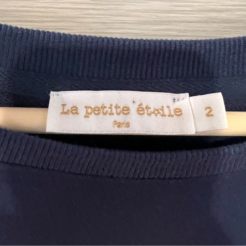 Girl’s beautiful blue sweater from Paris.